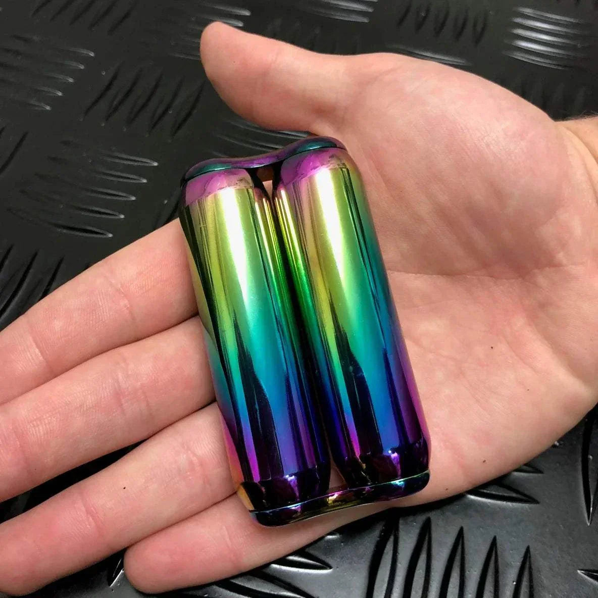 Smooth Hand Roller (305 gram) resting on a hand, featuring a sleek, colorful design with a unique velvety feel, perfect for fidgeting, exercising, and massaging.