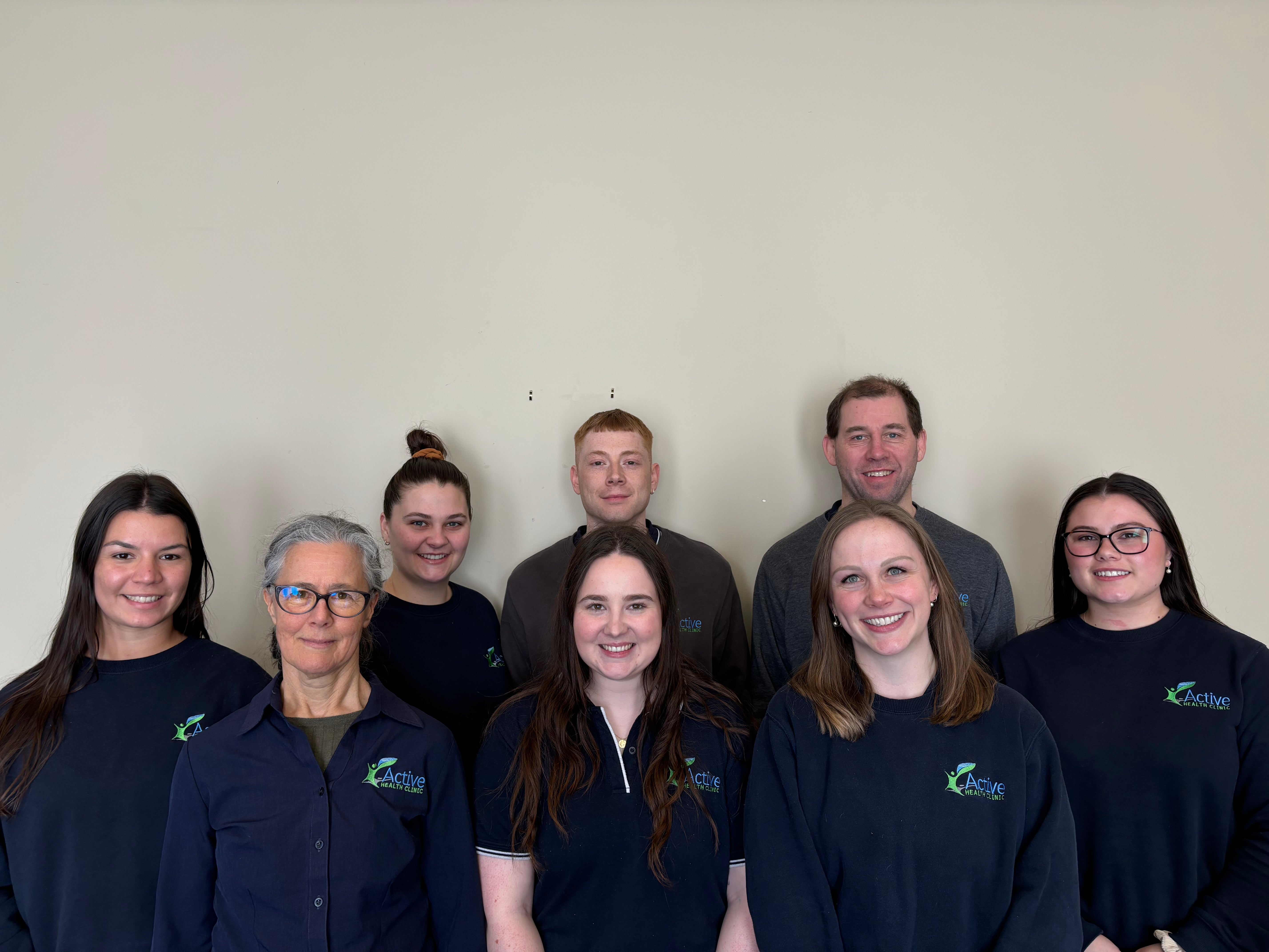 AHC staff standing and smiling