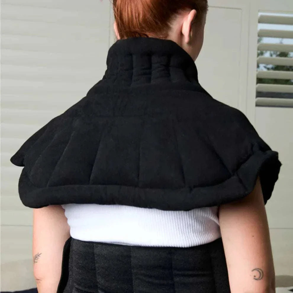 Kosi Snuggle Neck Heat Pack providing pain relief for neck and shoulders.