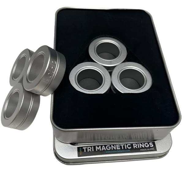 Three silver metal magnetic rings, stacked and shown separately on a plain background