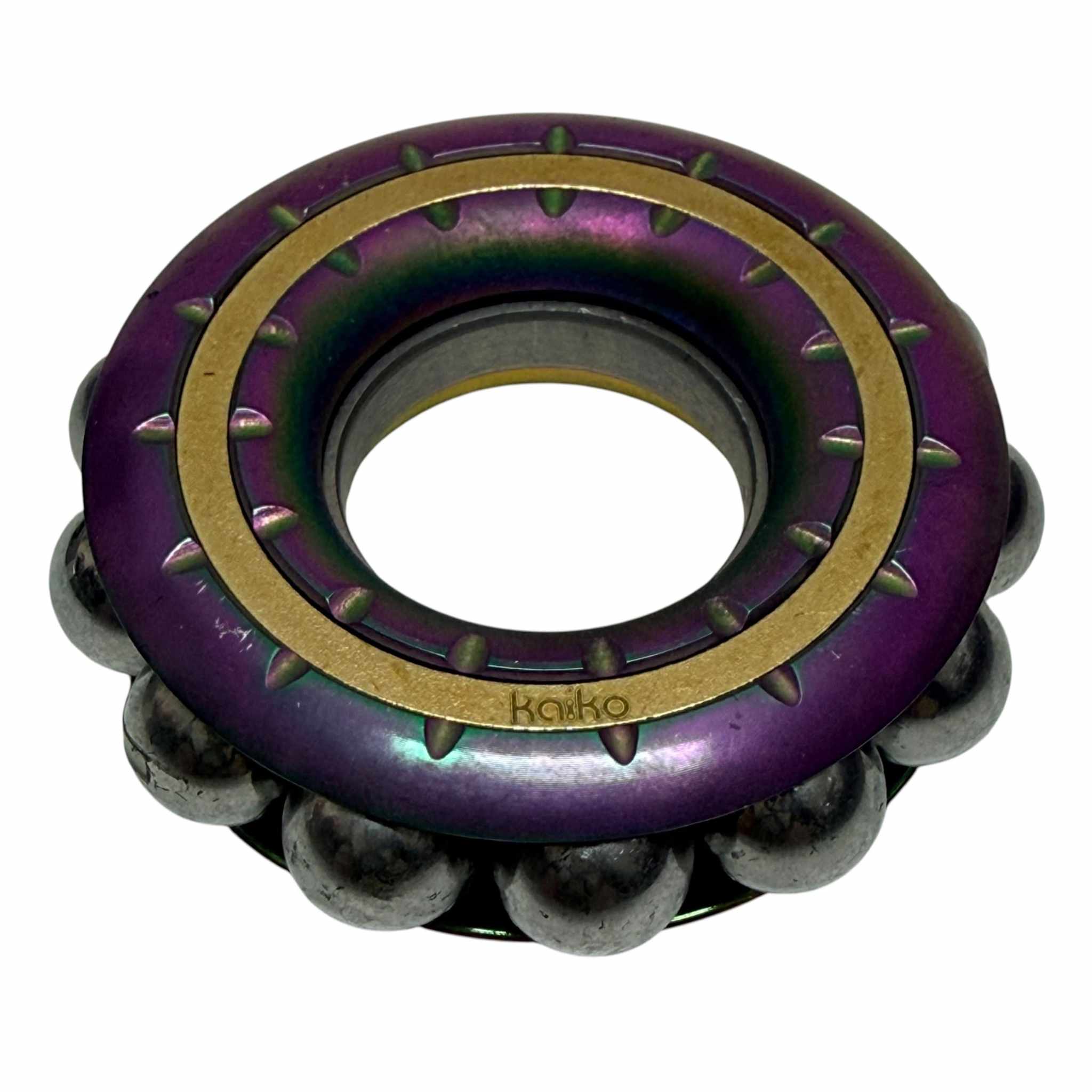 Oil slick finished Freewheel spinner with an open centre and an enclosed ring of steel balls