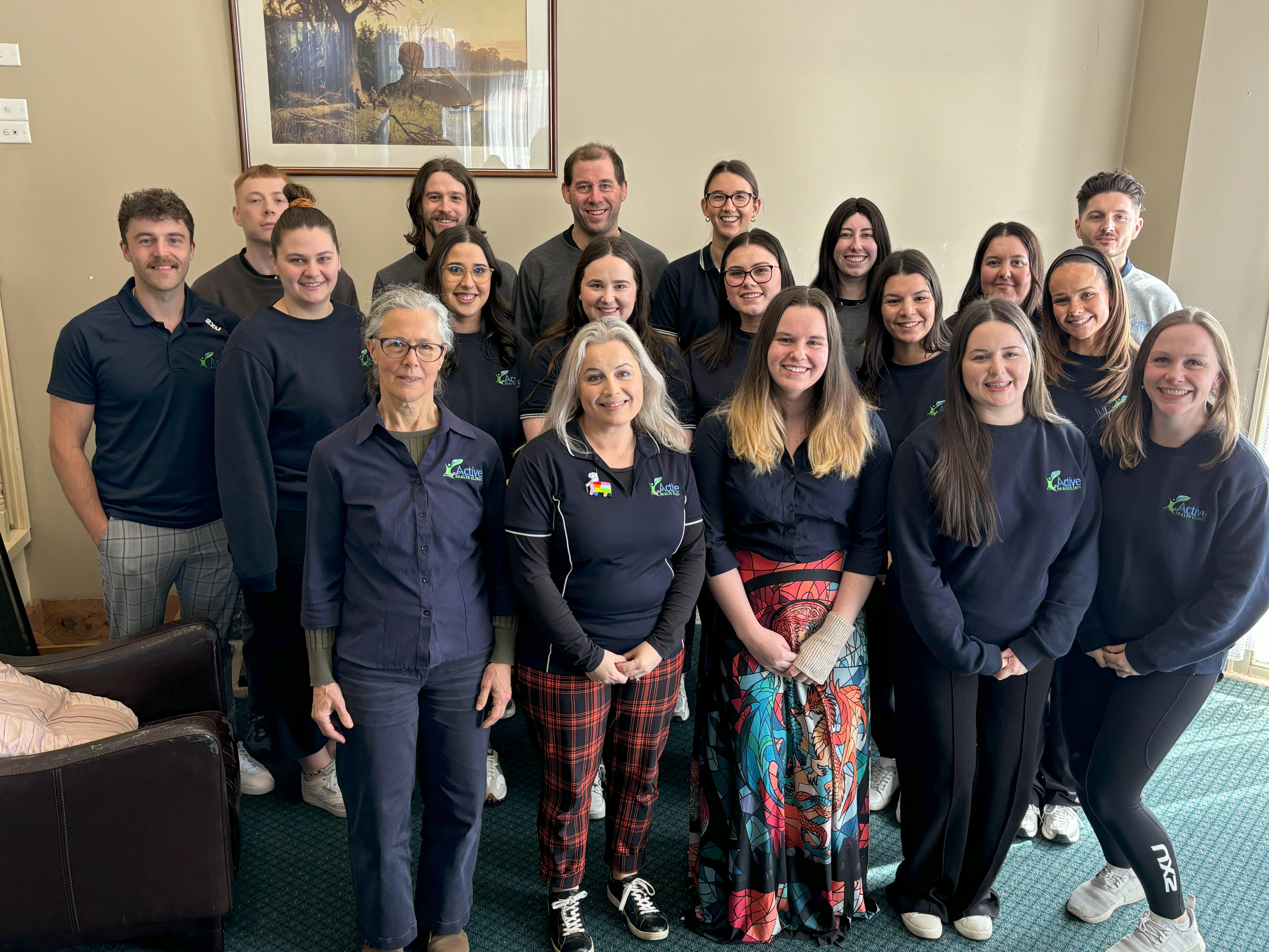 The entire AHC team smiling at the camera