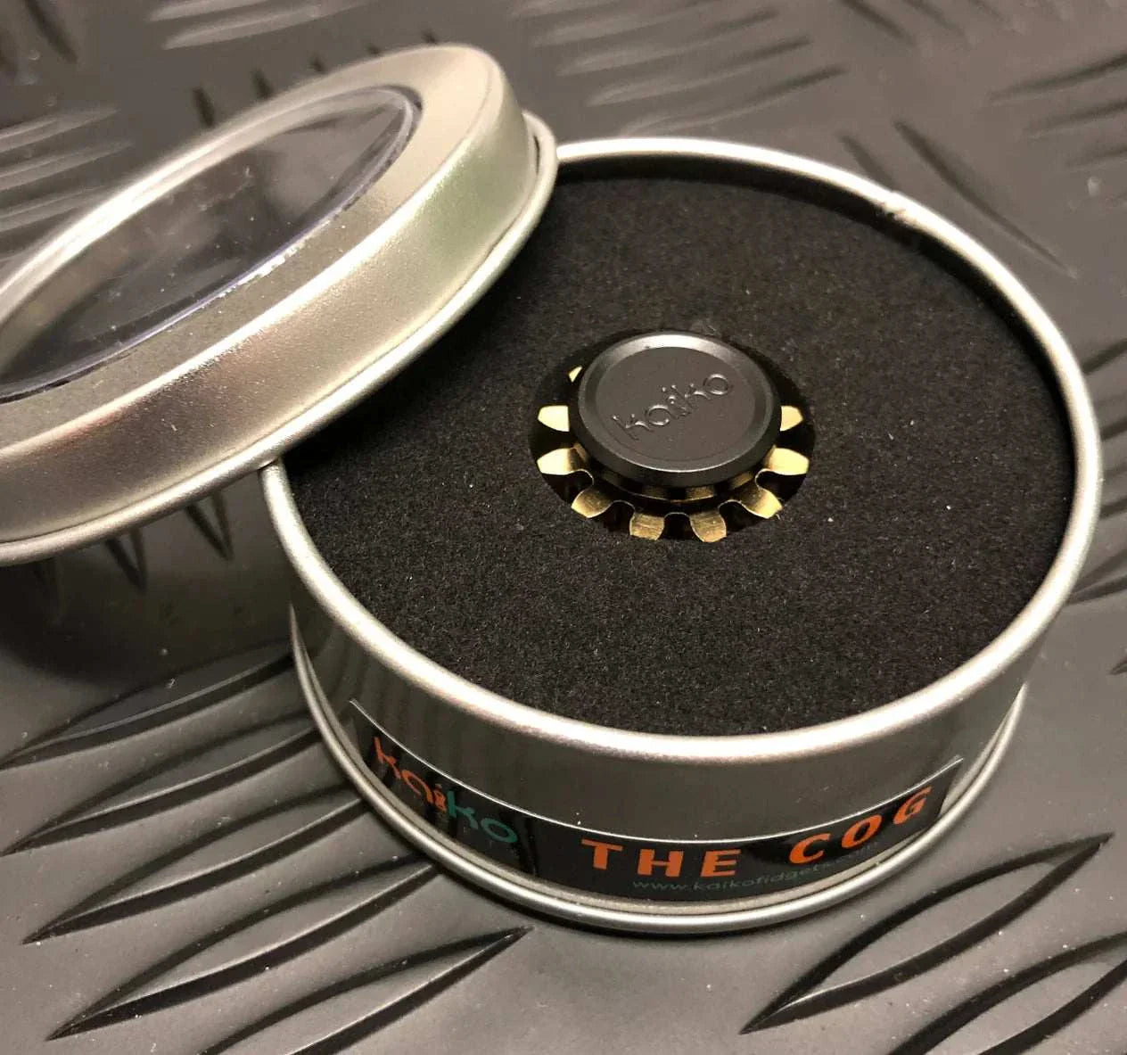 Compact Kaiko Mini Cog fidget spinner in metal tin packaging.
